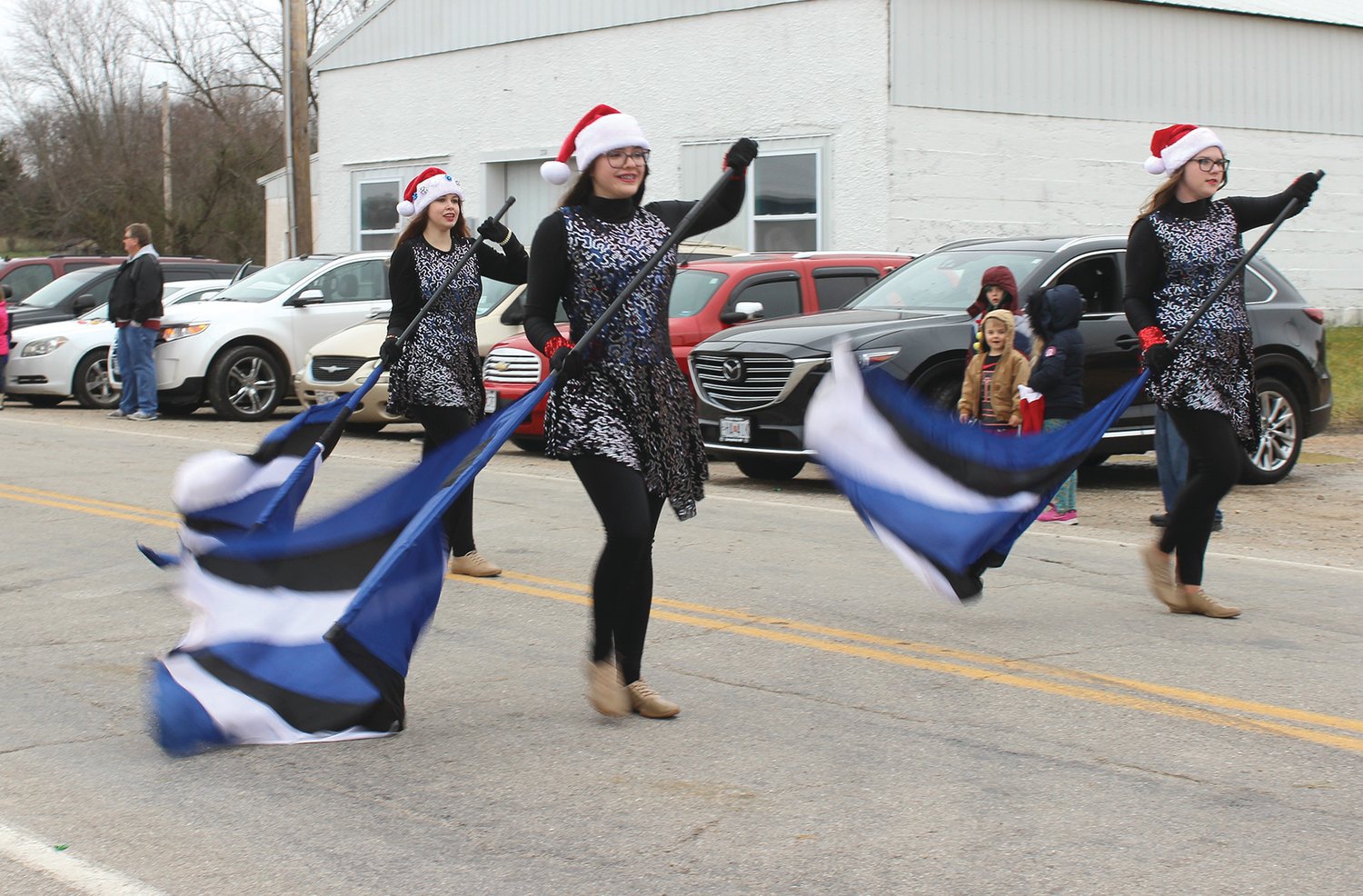 Hartville students perform a routine with colorful flags for the Hartville High School band.